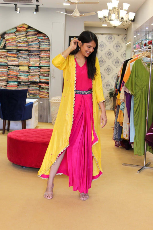 Pink Drape Dress With Yellow Jacket Having All Over Mirror Highlights.
